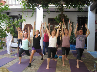 Happy yogis in Warrior One