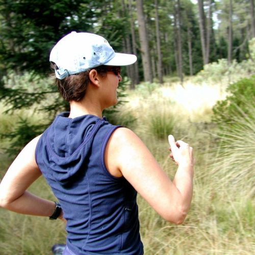 Girl running in the woods